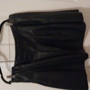 This is a black pleated pleather skirt that matches the pleather black jacket